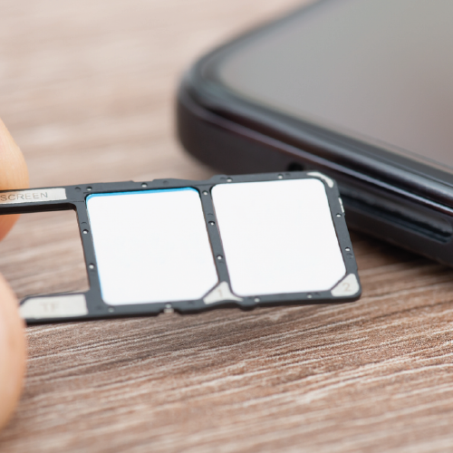 Person showing off a dual sim mobile phone for their business