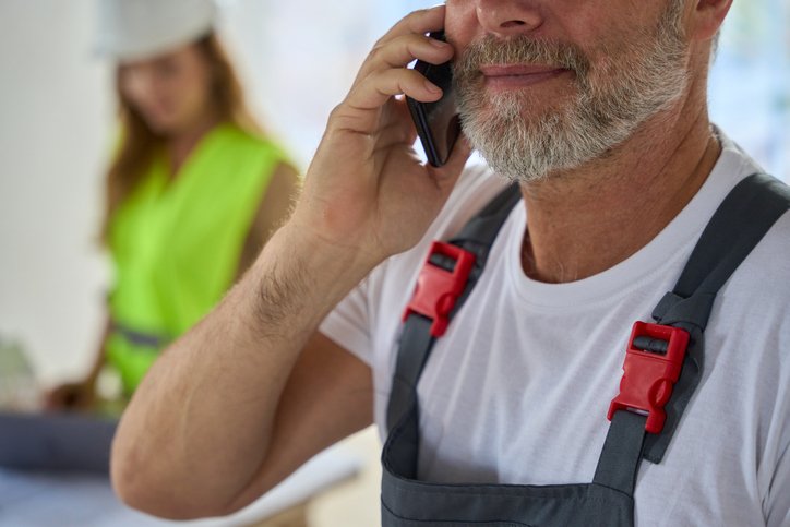 tradesman on a call to a customer