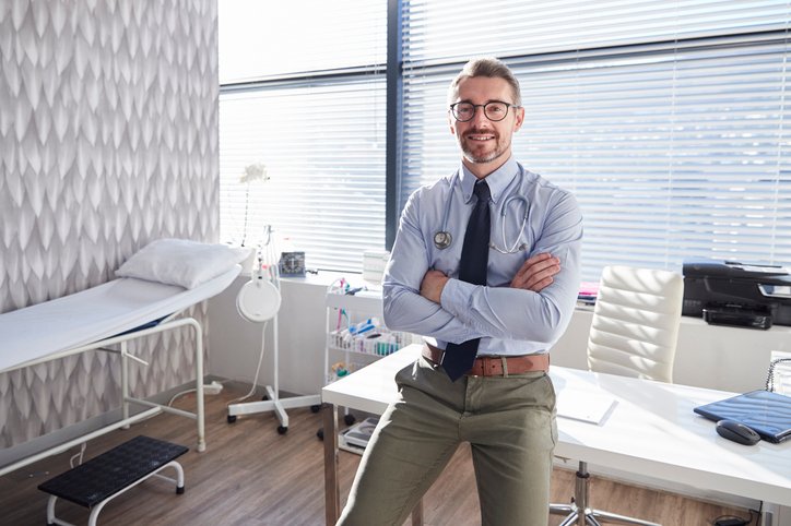 Websites for GP practices - a young doctor in his GP practice in North Dublin