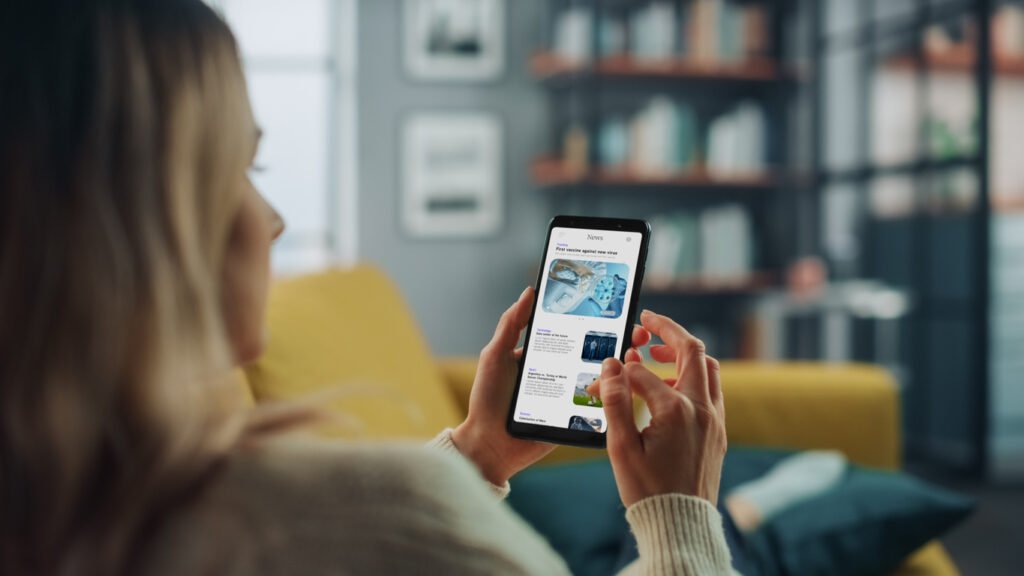 5 Key Things Customers Check Before They Hire A Tradesman - young woman reading reviews on her smart phone
