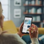 5 Key Things Customers Check Before They Hire A Tradesman - young woman reading reviews on her smart phone