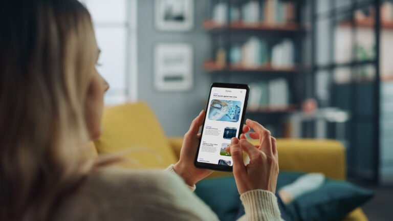 5 Key Things Customers Check Before They Hire A Tradesman - young woman reading reviews on her smart phone