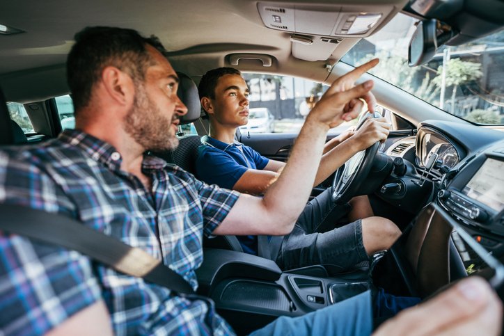 Websites for driving instructors - young man getting a driving lesson from an instructor in Dublin